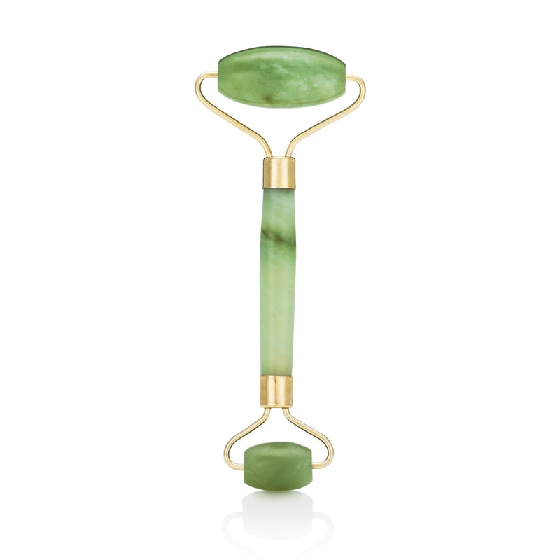 Green jade facial roller with two polished stones and gold-tone metal frame.