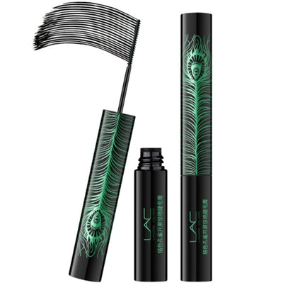 Black cylindrical mascara tube with green peacock feather design, curling brush wand displayed beside it.
